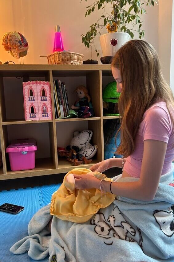 Image of child playing in the Sunflower House play therapy studio.